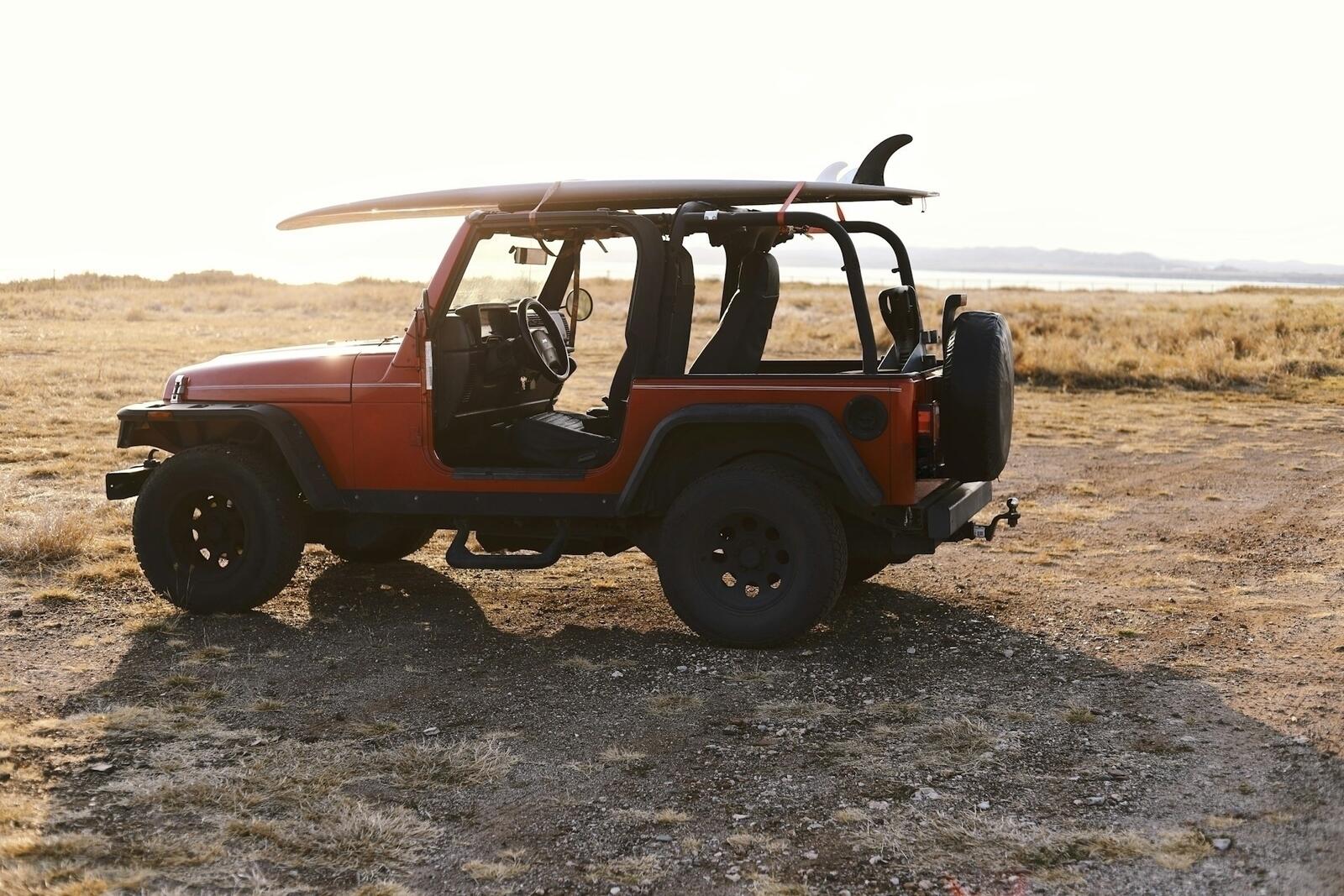 Jeep Wrangler with a roof rack loaded for overlanding